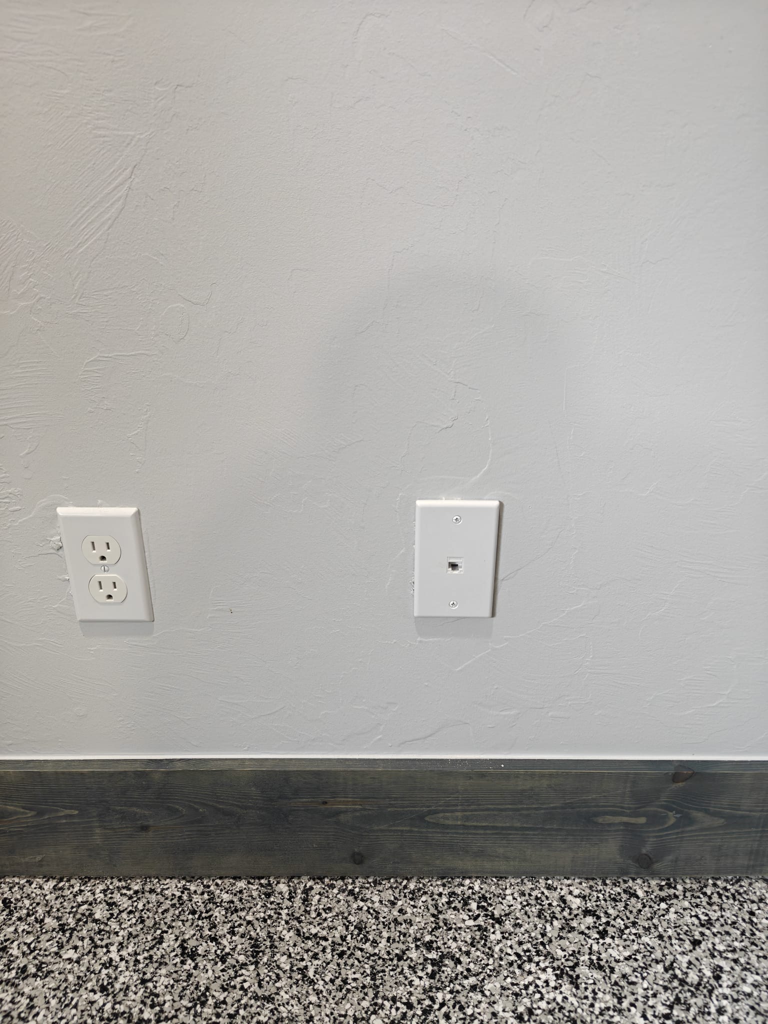Wall-mounted Ethernet data drop installation