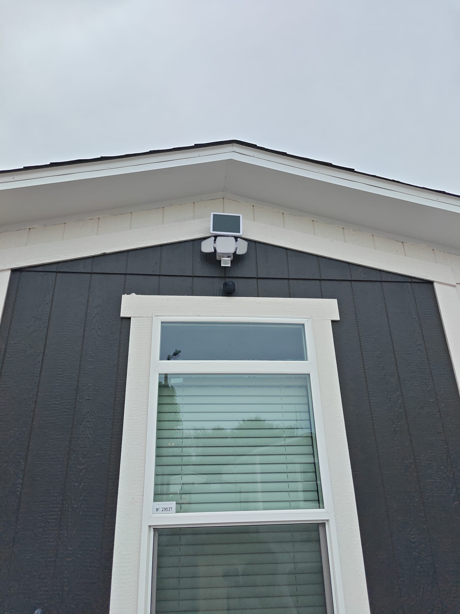 Motion-activated exterior floodlight installation